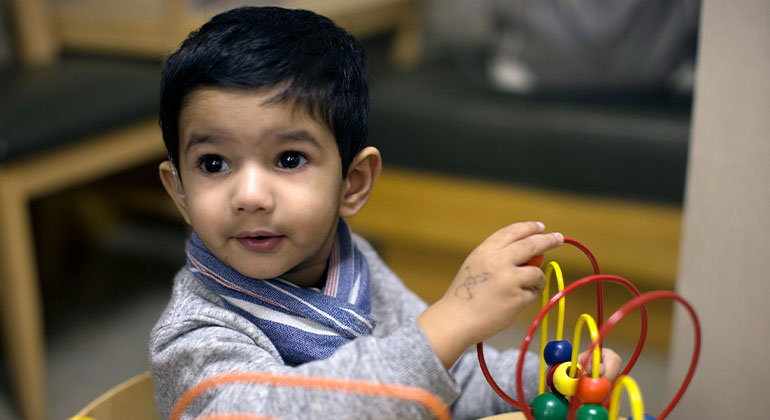 Child playing with toy